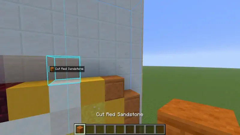 Pixel art of a golden apple being filled in block by block